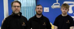three curran engineers in uniform