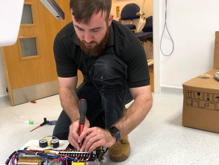 A curran engineer conducting dental maintenance