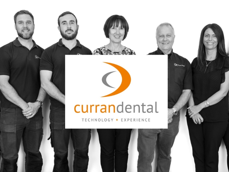 The Curran Dental team behind the Curran Dental logo