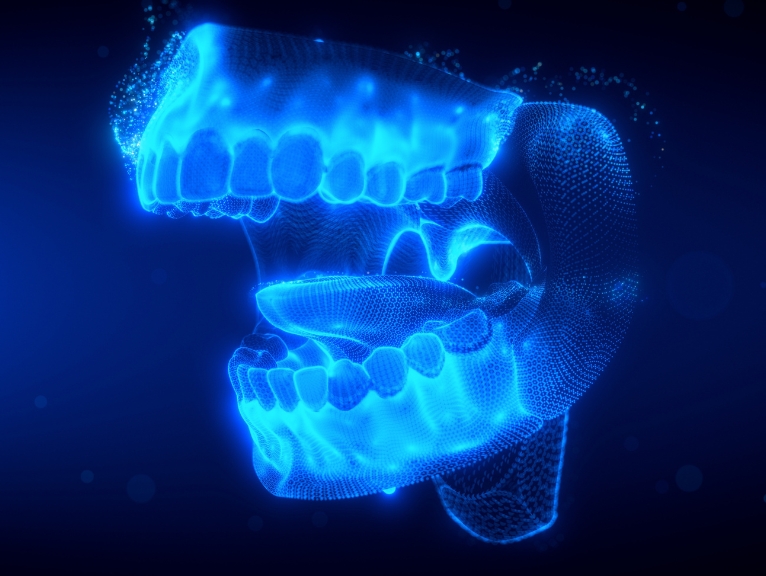 Digital dentistry systems: Blue 3D digital rendering of a human jaw and teeth model on a dark background