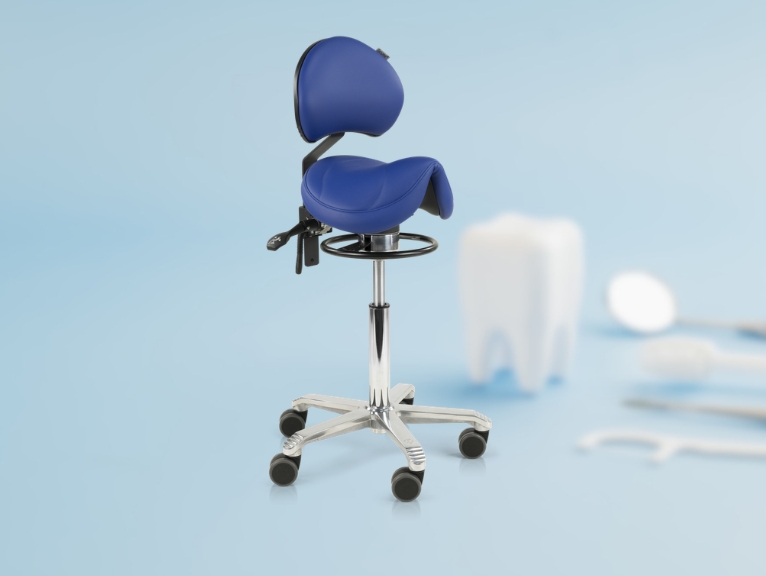 Ergonomic seating for dental professionals: A blue saddle-style ergonomic dental stool with a backrest, footrest ring, and chrome five-castor base, photographed against a light blue background with a blurred decorative tooth and dental instruments.