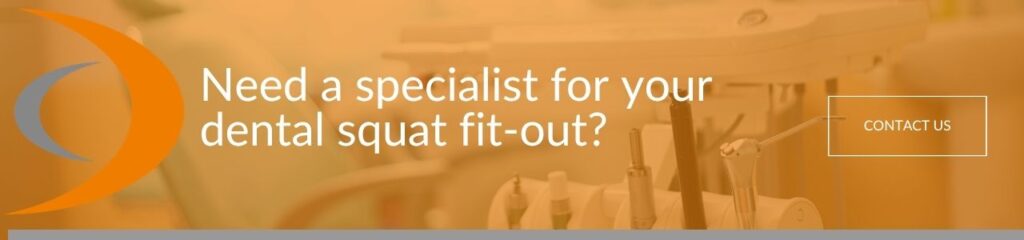 Need a specialist for your dental squat fit-out: A banner advertisement with white text reading "Need a specialist for your dental squat fit-out?" and a "Contact Us" button, overlaid on a blurred dental surgery background with an orange tint and a crescent logo.
